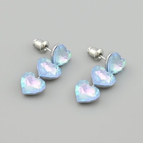 Сережки з кристалами Swarovski 53212 розмір 27х10 мм колір блакитний опал вага 5.9 г позолота Біле Золото 53212БЗблакоп фото